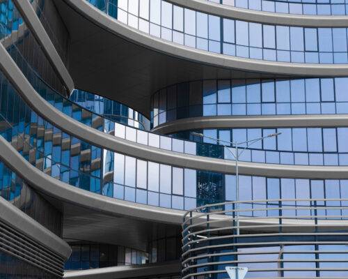 stylish office building blue glass and aluminum 2025 02 12 04 55 00 utc - Employment Bridge